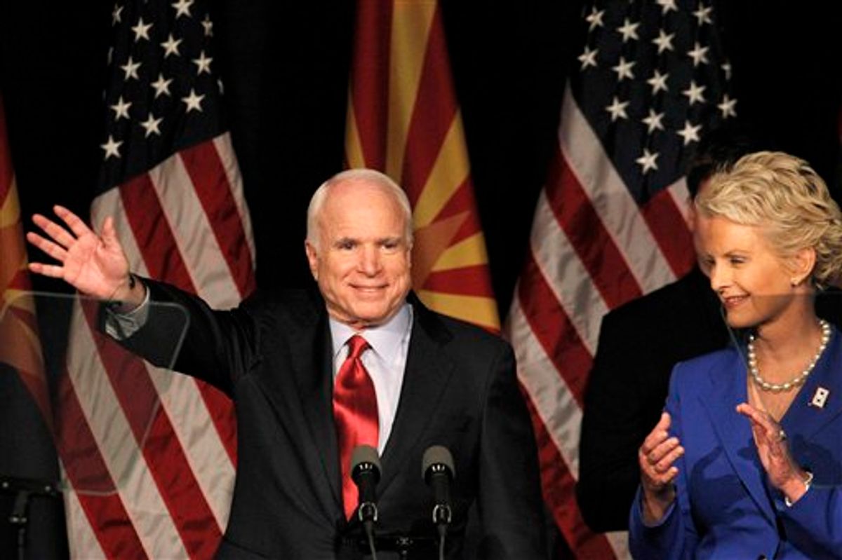 Sen. John McCain, R-Ariz., left, waves to supporters at an election victory party with his wife Cindy McCain, Tuesday, Aug. 24, 2010, in Phoenix.  In McCain's toughest Republican election primary in years, beating former congressman J.D. Hayworth. (AP Photo/Ross D. Franklin)    (AP)