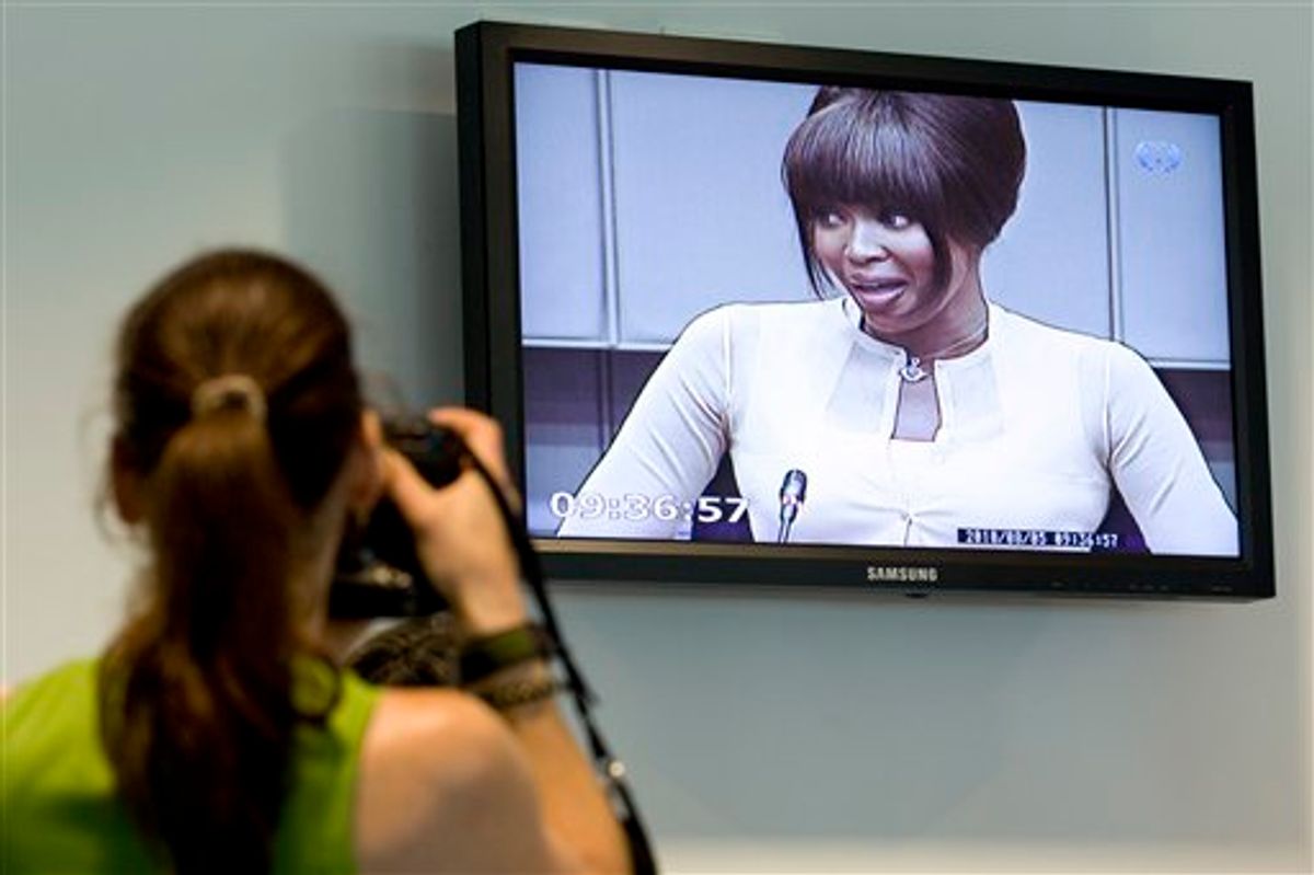 Naomi Campbell is seen on a screen in the pressroom of the U.N.-backed Special Court for Sierra Leone in Leidschendam, Netherlands, Thursday, Aug. 5, 2010. Naomi Campbell appeared at a Dutch courthouse to give evidence at the war crimes trial of former Liberian ruler Charles Taylor after the supermodel lost her battle to avoid testifying. Campbell will be questioned about claims made by actress Mia Farrow that Taylor gave the British model an uncut diamond after a dinner party hosted by Nelson Mandela in South Africa in 1997. Prosecutors say if that's true, it's evidence that he received diamonds from Sierra Leone rebels in exchange for weapons during that country's 1992-2002 civil war. The court did not give permission to take photos of Naomi Campbell inside the courtroom. (AP Photo/Vincent Jannink)  (AP)