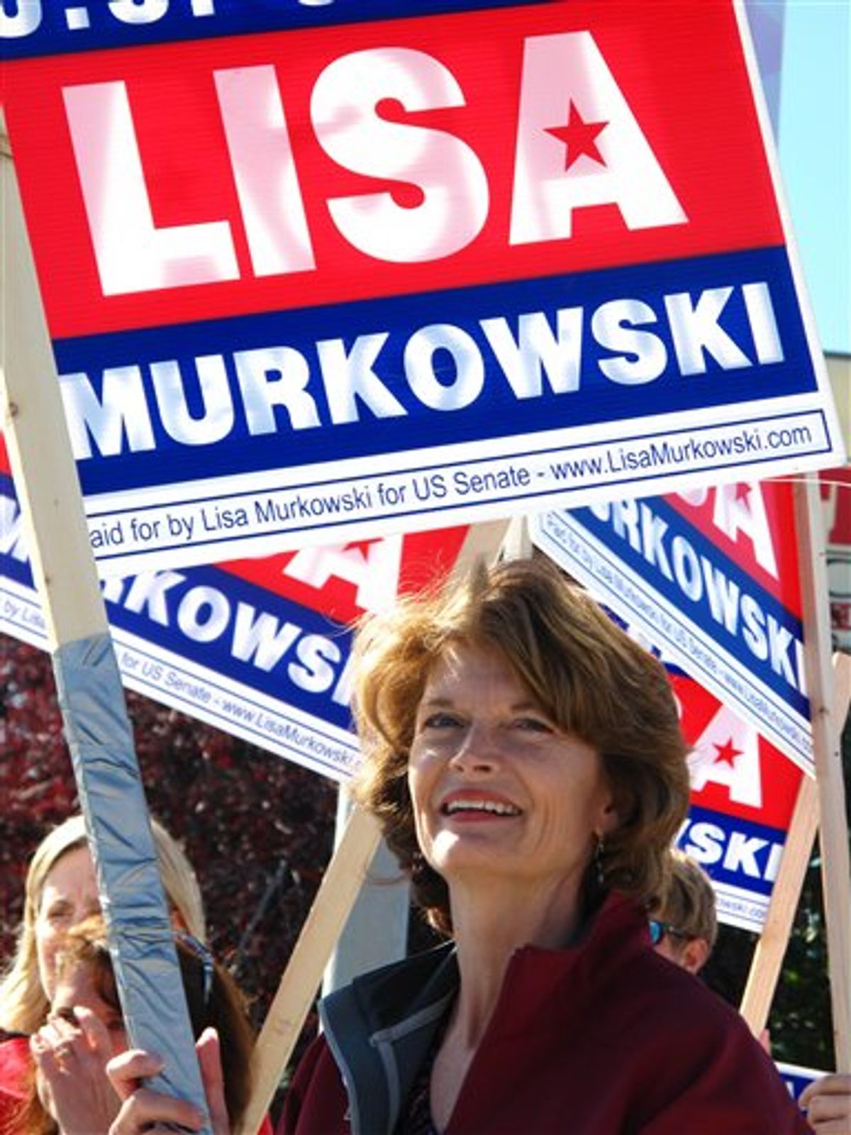 U.S. Sen. Lisa Murkowski, R-Alaska, right, joins volunteers to wave to motorists on Monday, Aug. 23, 2010, in Anchorage, Alaska.  Candidates are pulling no punches in their last minute push for voters in Tuesday's primary. The greatest proof of this is in the U.S. Senate race where Sarah Palin has re emerged months after first endorsing GOP challenger Joe Miller to urge Alaskans to support him and to oust Murkowski. Murkowski's not shying away, running a new radio spot of her own, called "Truth," in which she uses audio from a talk show host's tirade against Miller to show Miller as distorting her record. (AP Photo/Mark Thiessen) (AP)