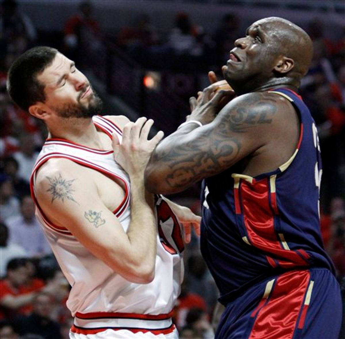 Cleveland Cavaliers' Shaquille O'Neal, right, drives to the basket against Chicago Bulls' Brad Miller during the first quarter of Game 3 in the first round of the NBA basketball playoffs on Thursday, April 22, 2010, in Chicago. (AP Photo/Nam Y. Huh) (AP)