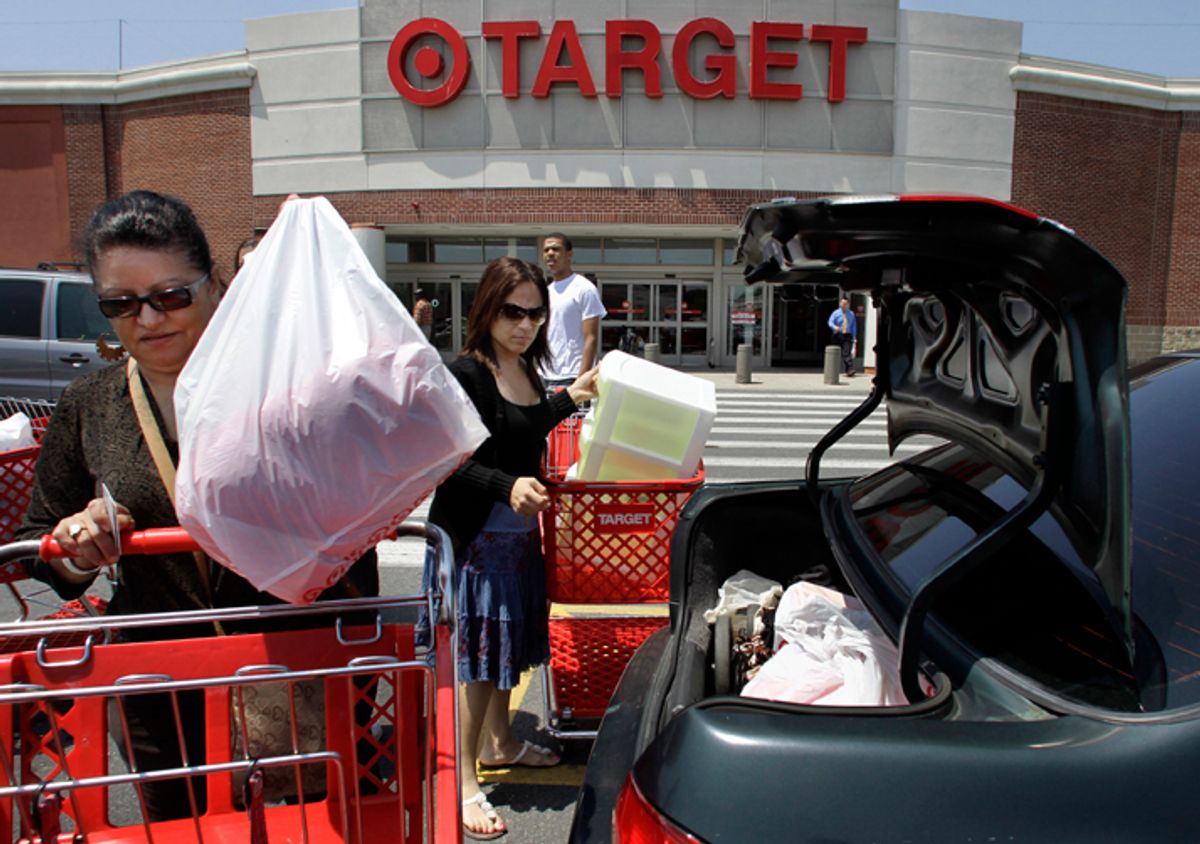 FILE - In this file photograph taken June 2, 2010, shoppers Joselin Pena, left, and her niece Ingrid Romero, center, both of Boston, load packages into their car after shopping at a Target location, in Boston. A monthly consumer survey shows that Americans' confidence in the economy eroded further in July amid job worries. The reading raises concern about the economic recovery and the back-to-school shopping season.(AP Photo/Steven Senne, file) (Steven Senne)