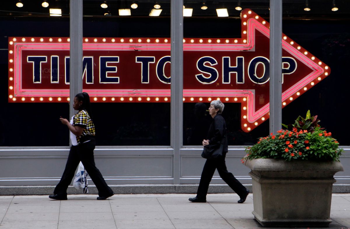 Pedestrians walk by the window display at an Old Navy store in Monday, Sept. 21, 2009 in downtown Chicago. (AP Photo/Kiichiro Sato) (Kiichiro Sato)