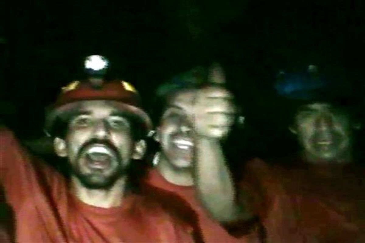 In this TV grab taken from a video released by Chile's government on Tuesday, Aug. 31, miners react inside the San Jose mine in Copiapo, Chile. Thirty-three miners have been trapped deep underground in the copper and gold mine since it collapsed on Aug. 5.  (AP Photo/Chile's Government Video) (AP)