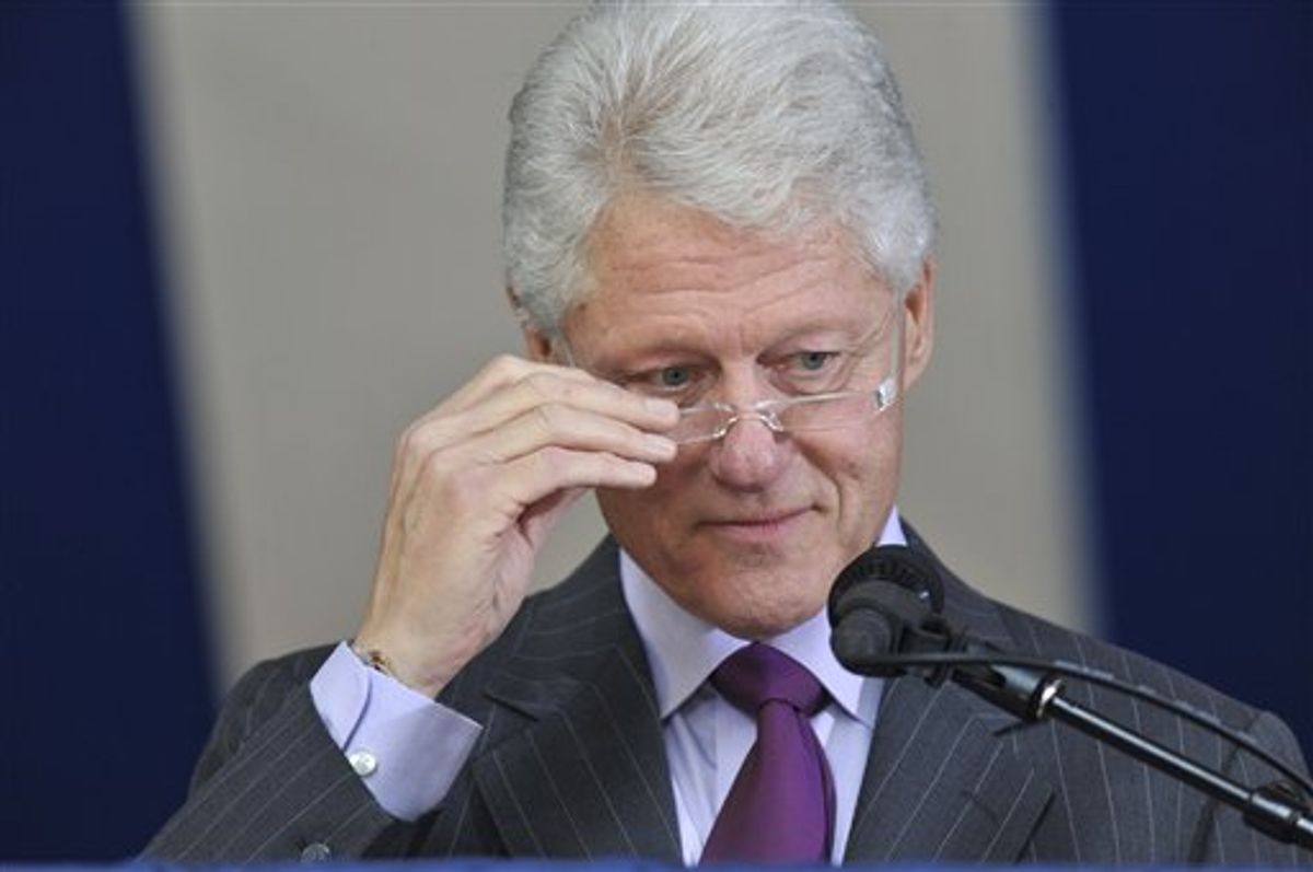 Former President Bill Clinton adjusts his glasses as he delivers the Yale Class Day Address at Yale University in New Haven, Conn., Sunday, May 23, 2010.  (AP Photo/Jessica Hill)  (AP)