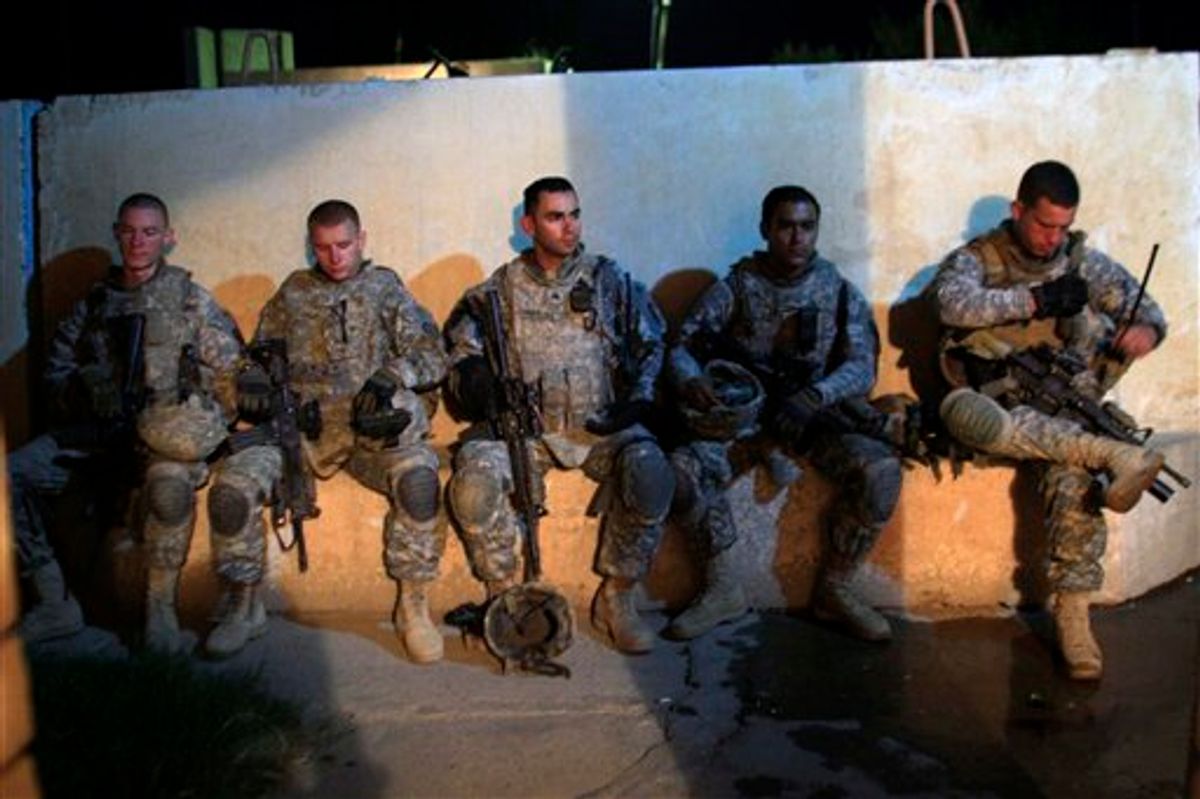 US Army soldiers from 1st Battalion, 14th Infantry Regiment sit in a courtyard outside an Iraqi police station during a joint operation with Iraqi security forces on the first day after America ended its combat role, Wednesday, Sept. 1, 2010 in Hawija, north of Baghdad, Iraq.  The U.S. marks on Wednesday the transition to the final phase of the Iraq war, shifting the focus of the remaining 50,000 American troops from combat operations to preparing Iraqi security forces to protect the country on their own. (AP Photo/Maya Alleruzzo) (AP)