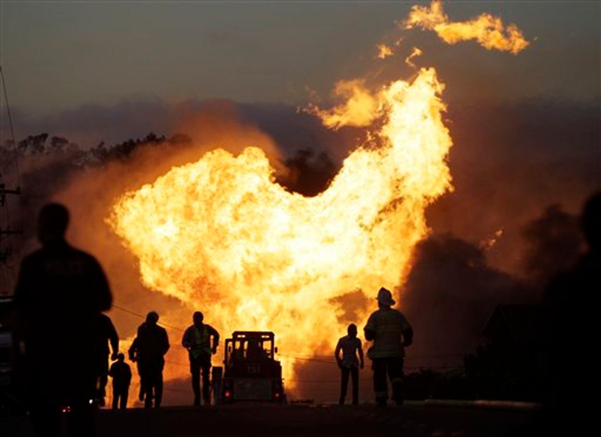 A massive fire is roars through a mostly residential neighborhood in San Bruno, Calif., Thursday, Sept. 9, 2010. Firefighters from San Bruno and surrounding cities are battling the blaze that started on a hillside and is now consuming homes in a residential neighborhood. (AP Photo/Paul Sakuma) (AP)