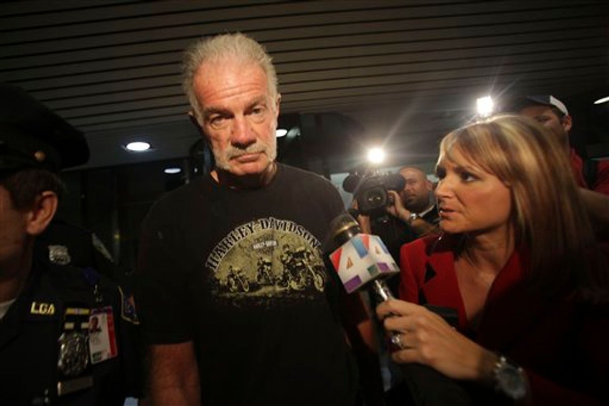 Pastor Terry Jones is surrounded by reporters as he arrives at Laguardia airport, Friday, Sept. 10, 2010 in New York.  (AP Photo/Mary Altaffer)  (AP)