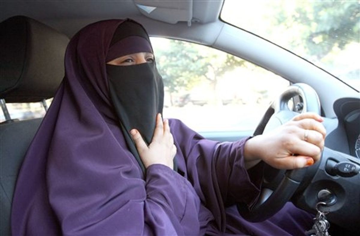 France's Kenza Drider , wearing a niqab,  drives a car  in Avignon, southern France, Monday, Sept. 13, 2010.   A ban on the burqa-style veil, to be voted on Tuesday in the Senate, would affect only a tiny minority of Muslim women _ estimated at less than 2,000 _ making it far less controversial than France's 2004 ban on Muslim headscarves in classrooms, which proliferated in heavily immigrant neighborhoods. (AP Photo/Claude Paris) (AP)