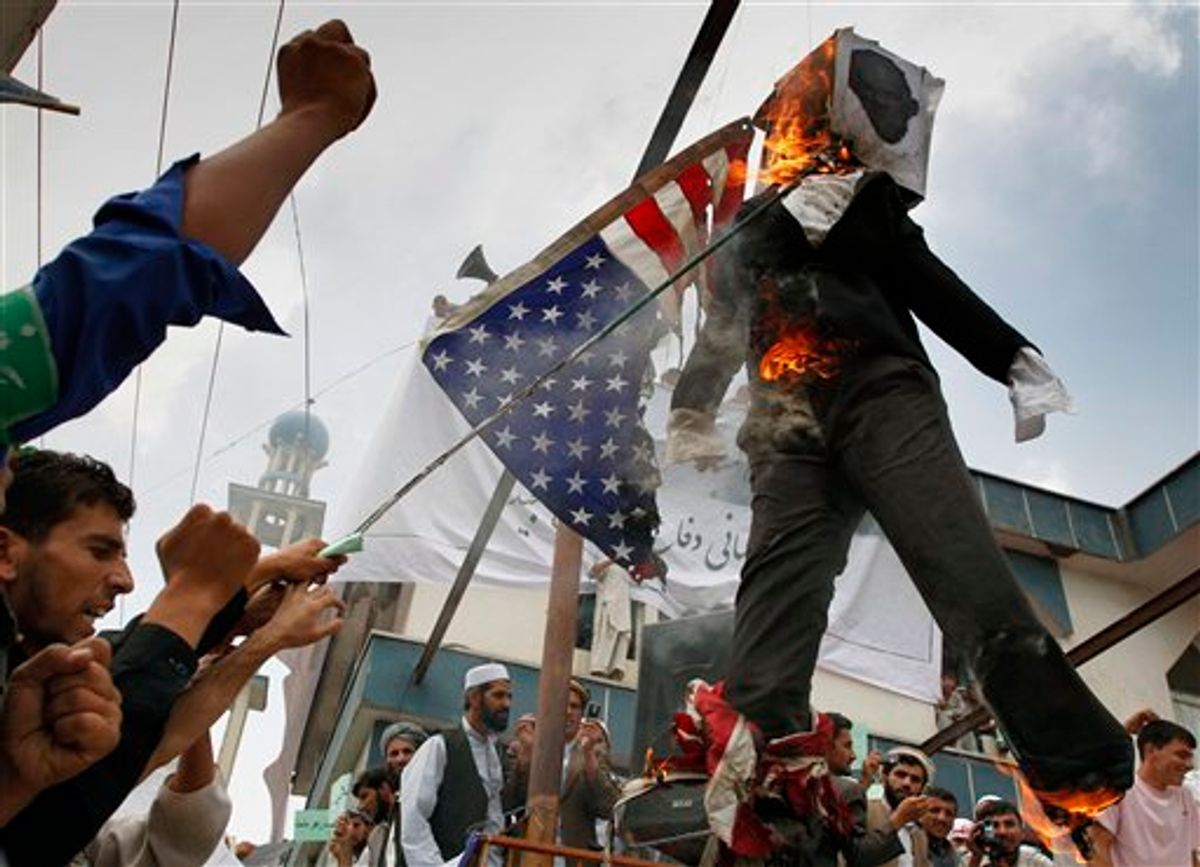Afghans burn an effigy of Dove World Outreach Center's pastor Terry Jones during a demonstration against the United States in Kabul, Afghanistan, Monday, Sept. 6, 2010. Hundreds of Afghans railed against the U.S. and called for President Barack Obama's death at a rally in the capital Monday to denounce the American church's plans to burn the Islamic holy book on 9/11. (AP Photo/Musadeq Sadeq) (AP)