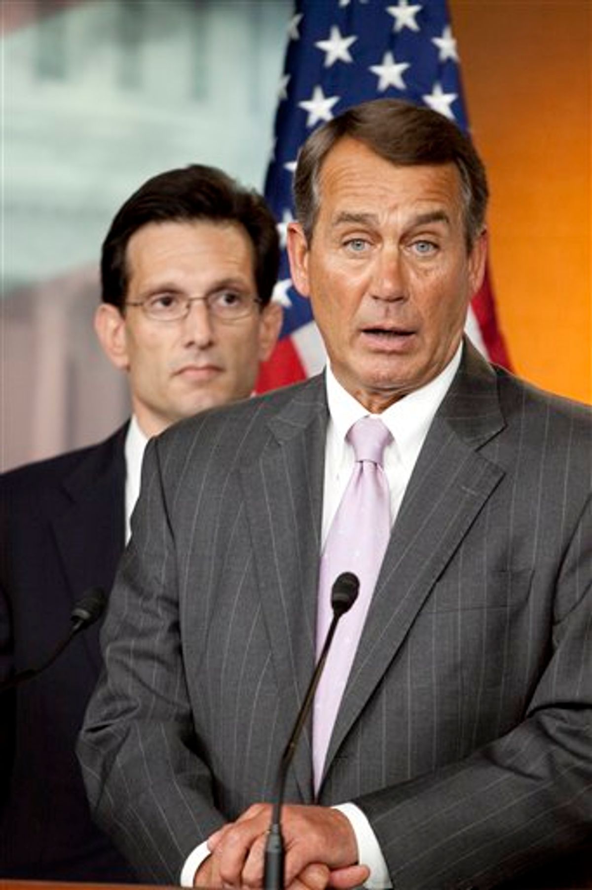 FILE - In this April 5, 2010 file photo, House Minority Leader John Boehner of Ohio, right, accompanied by House Minority Whip Eric Cantor of Va., speaks on Capitol Hill in Washington. Boehner could walk down most U.S. streets anonymously. But the perpetually tanned golf lover, who grew up in a Cincinnati family of 14, could become the next House speaker and the GOP leader of opposition to President Barack Obama.  (AP Photo/Harry Hamburg, File)  (AP)