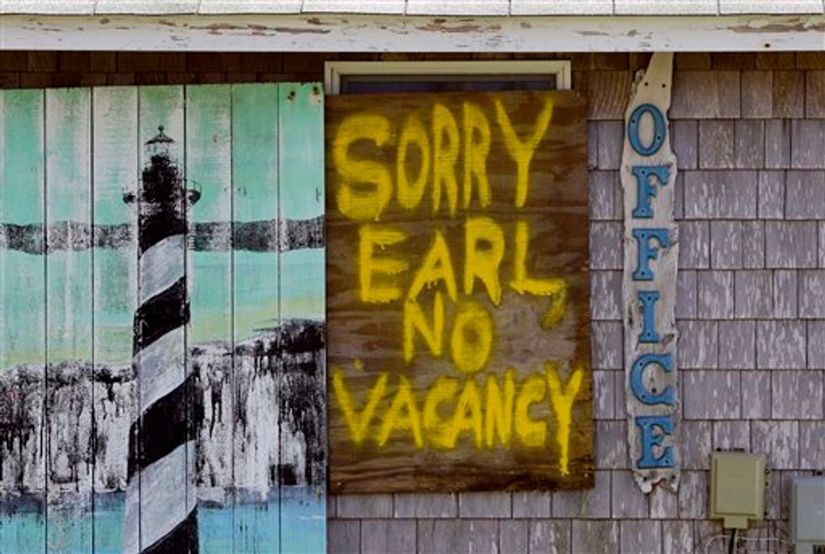 A window is boarded up with a message at the Buxton Beach Motel in Buxton, N.C., Wednesday, Sept. 1, 2010 as Hurricane Earl approaches North Carolina's Outer Banks. (AP Photo/Gerry Broome) (AP)