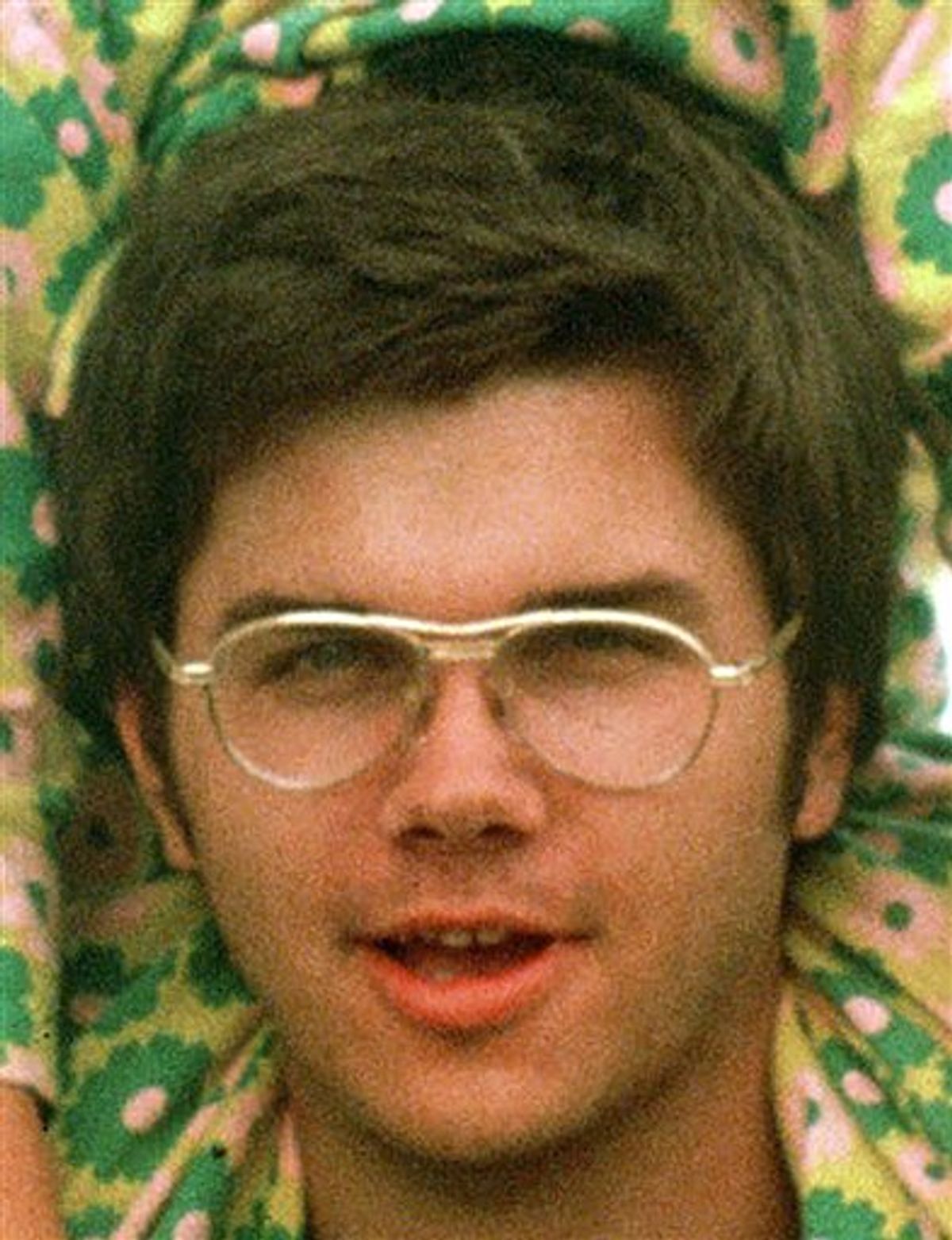 FILE - In this 1975 file photo, Mark David Chapman is seen at Fort Chaffee near Fort Smith, Ark. John Lennon's killer will seek his freedom for a sixth time in an interview before a parole board as early as Tuesday, Aug. 10, 2010. A parole hearing for Chapman, now 55, is scheduled at Attica Correctional Facility, the upstate New York prison where he has been held for nearly 30 years. Lennon's widow, Yoko Ono, continues to oppose Chapman's release. (AP Photo/Greg Lyuan, File)  (AP)