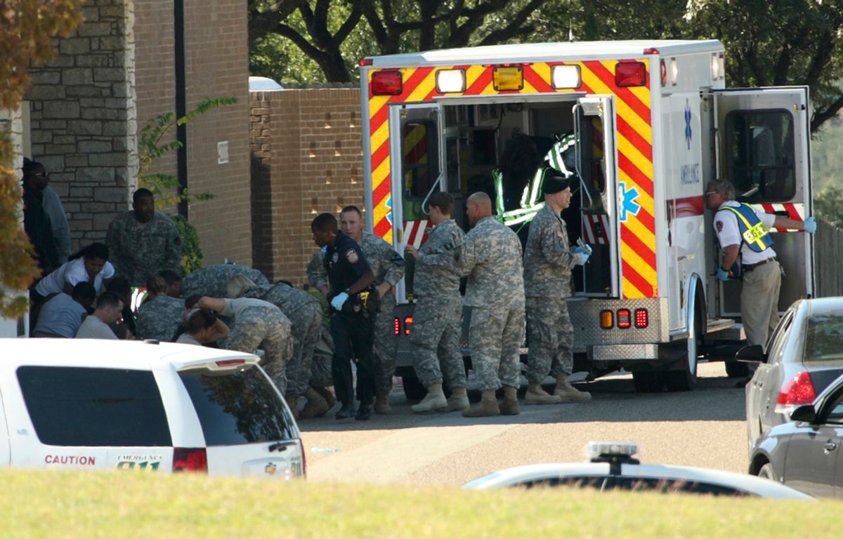 First responders prepare the wounded for transport in waiting ambulances outside Fort Hood's Soldier Readiness Processing Center, after a mass shooting at the military base November 5, 2009. Investigators searched for the motive on Friday behind the mass shooting at the sprawling U.S. Army base in Texas, in which an Army psychiatrist trained to treat war wounded is suspected of killing 13 people. The suspected gunman, Major Nidal Malik Hasan, a Muslim born in the United States of immigrant parents, was shot four times by police, a base spokesman said. He was unconscious but in stable condition. Photo taken November 5, 2009.    REUTERS/Jeramie Sivley/U.S. Army photo/Handout    (UNITED STATES MILITARY CRIME LAW CONFLICT HEALTH) FOR EDITORIAL USE ONLY. NOT FOR SALE FOR MARKETING OR ADVERTISING CAMPAIGNS     (Â© Ho New / Reuters)
