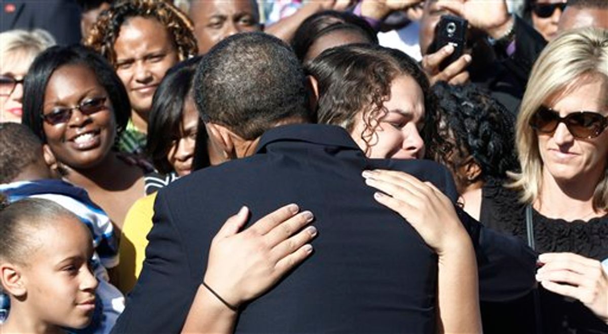 President Barack Obama hugs an unidentified woman as he greets family members of victims after speaking at the Pentagon Memorial, marking the ninth anniversary of the September 11 attacks, Saturday, Sept. 11, 2010. (AP Photo/Charles Dharapak) (AP)