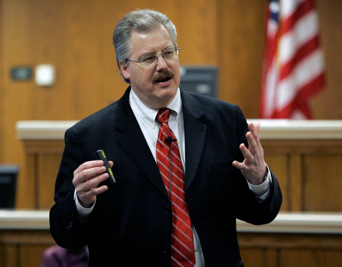 ** FILE **This March 2007 file photo shows Calumet County District Attorney Kenneth Kratz giving his closing argument in the Steven Avery trial in the courtroom in Chilton, Wis. Police say Kratz sent repeated text messages trying to spark an affair with a domestic abuse victim while he was prosecuting her ex-boyfriend. (AP Photo/Morry Gash)     (Morry Gash)