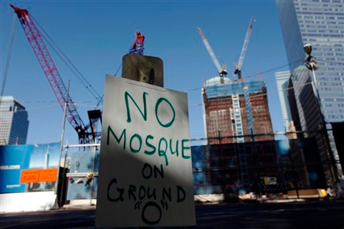A sign opposing a proposed Islamic community center near ground zero is seen in New York, Saturday, Sept. 11, 2010. (AP Photo/Matt Rourke) (AP)