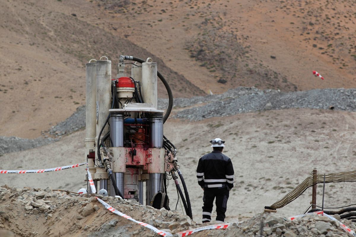 A man stands in front of a new drill to be used in the rescue operation of miners at the San Jose mine in Copiapo, Chile, Thursday, Sept. 2, 2010. Thirty-three miners have been trapped deep underground in the copper and gold mine since it collapsed on Aug. 5. (AP Photo/Martin Mejia, Pool) (Martin Mejia)