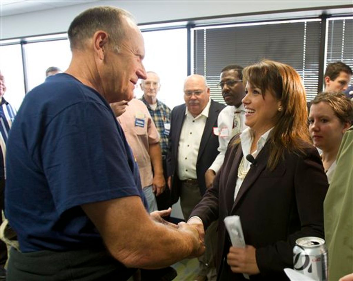 Delaware Republican Senate candidate Christine O'Donnell, right, greets supporters during a rally, Friday, Oct. 1, 2010, at her new campaign headquarters in Wilmington, Del. (AP Photo/Rob Carr) (AP)