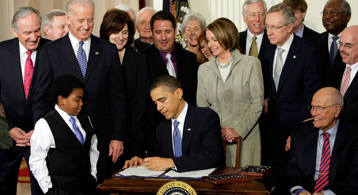President Obama signs the healthcare bill in the East Room of the White House, on March 23, 2010.