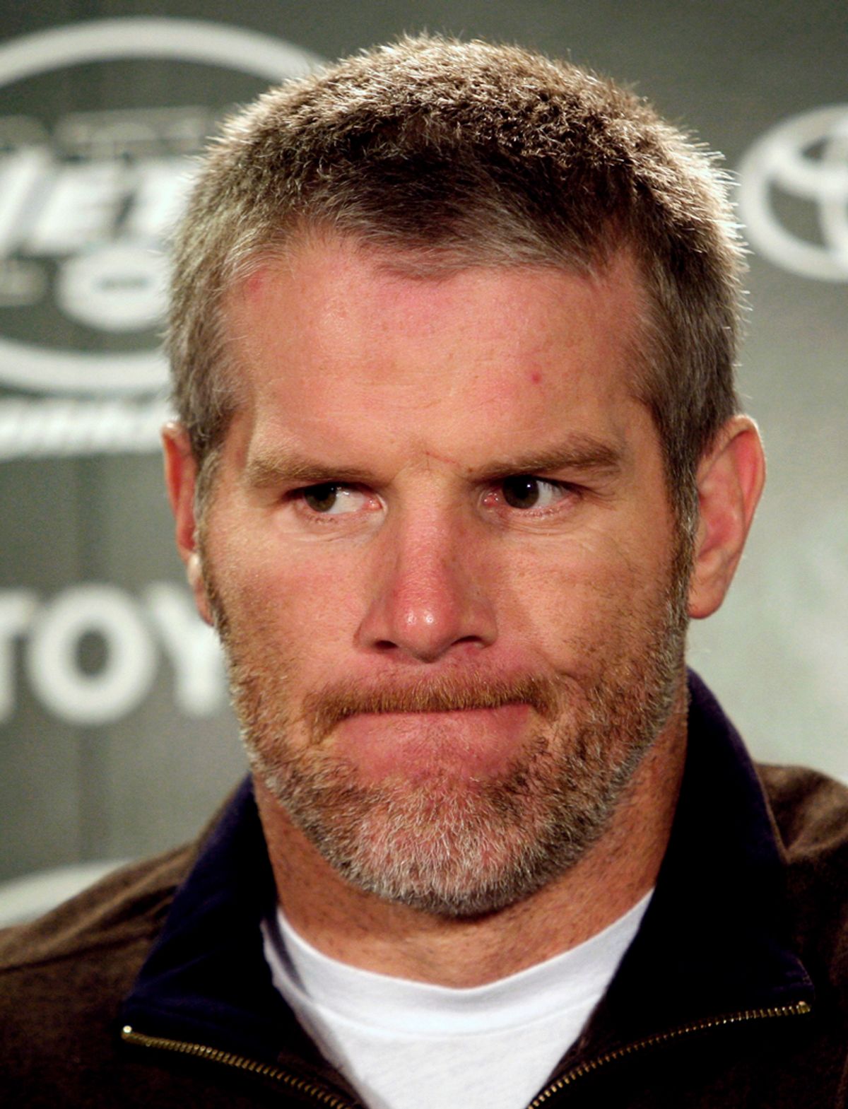 New York Jets quarterback Brett Favre reacts during a news conference after their loss to the Miami Dolphins in their NFL football game in East Rutherford, New Jersey, December 28, 2008. REUTERS/Mike Segar (UNITED STATES)   (Â© Mike Segar / Reuters)