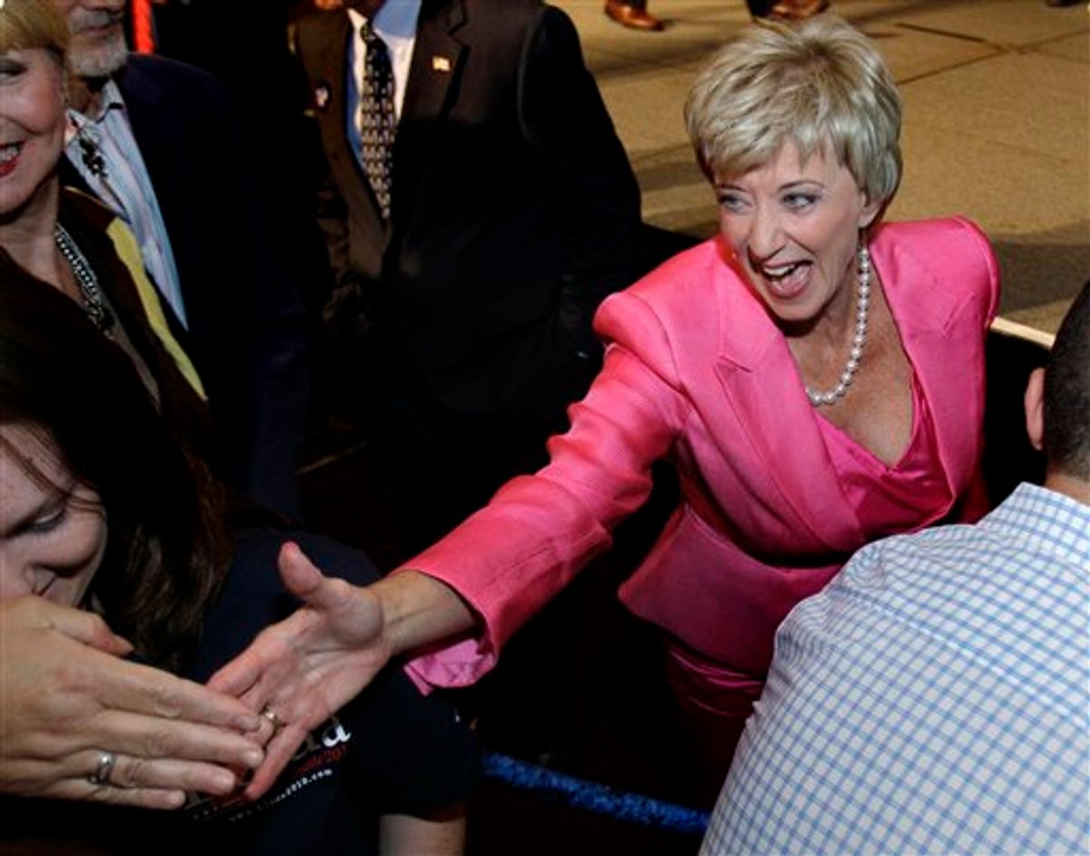 Republican candidate for U.S. Senate Linda McMahon, a former wrestling executive, reaches into the crowd to shake hands with supporters during her campaign party after winning the Republican primary in Cromwell, Conn., Tuesday, Aug. 10, 2010. (AP Photo/Charles Krupa)  (AP)