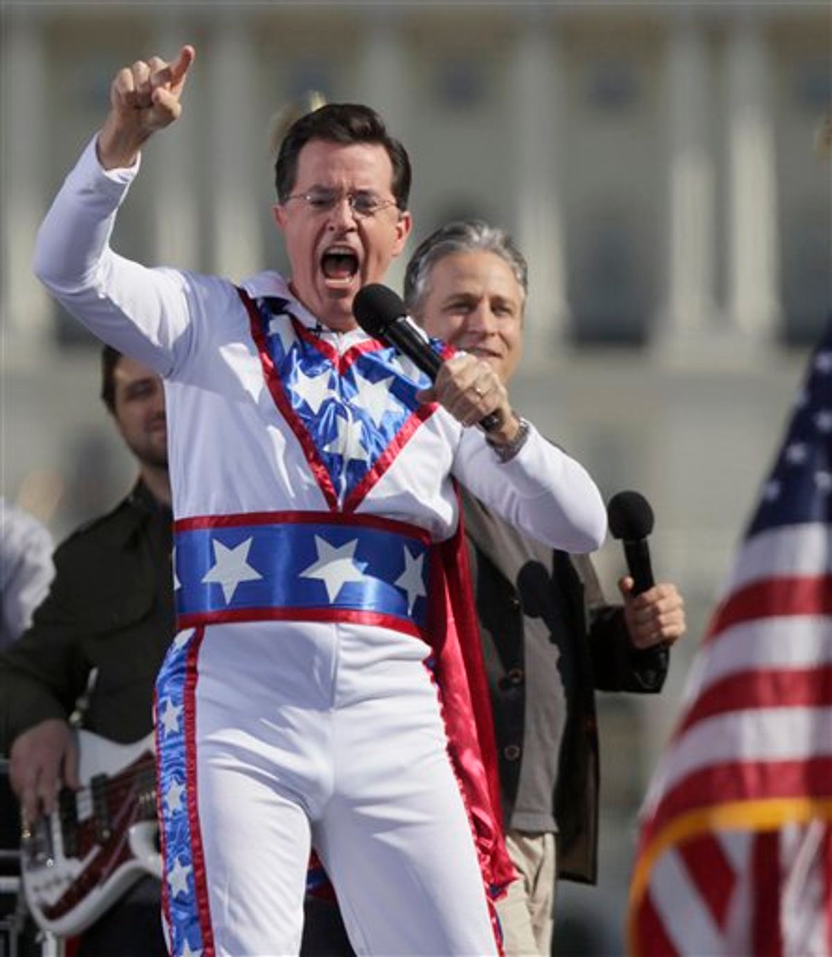 Comedian Stephen Colbert shouts to the crowd during the Rally to Restore Sanity and/or Fear on the National Mall in Washington, Saturday, Oct. 30, 2010. The "sanity" rally blending laughs and political activism drew thousands to the National Mall Saturday, with comedians Jon Stewart and Colbert casting themselves as the unlikely maestros of moderation and civility in polarized times. (AP Photo/Carolyn Kaster) (AP)