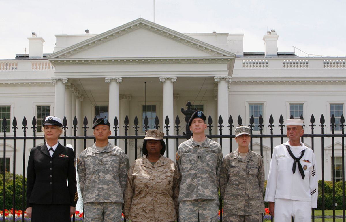 FILE - In this Tuesday, April 16, 2010 picture, from left, Petty Officer Autumn Sandeen,  Lt. Dan Choi, Cpl. Evelyn Thomas, Capt. Jim Pietrangelo II, Cadet Mara Boyd and Petty Officer Larry Whitt, stand together after they handcuffed themselves to the fence outside the White House in Washington during a protest for gay rights.  A federal judge issued a worldwide injunction Tuesday stopping enforcement of the "don't ask, don't tell" policy, ending the military's 17-year-old ban on openly gay troops.   U.S. District Judge Virginia Phillips declared the law unconstitutional after a two-week nonjury trial on the case in federal court in Riverside.  U.S. Department of Justice attorneys have 60 days to appeal. Legal experts say they are under no legal obligation to do so and could let Phillips' ruling stand.  (AP Photo/Pablo Martinez Monsivais) (Pablo Martinez Monsivais)