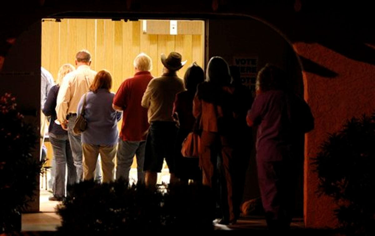 Voters line up to vote before sunrise on election day Tuesday, Nov. 2, 2010, in Apache Junction, Ariz. (AP Photo/Ross D. Franklin) (AP)
