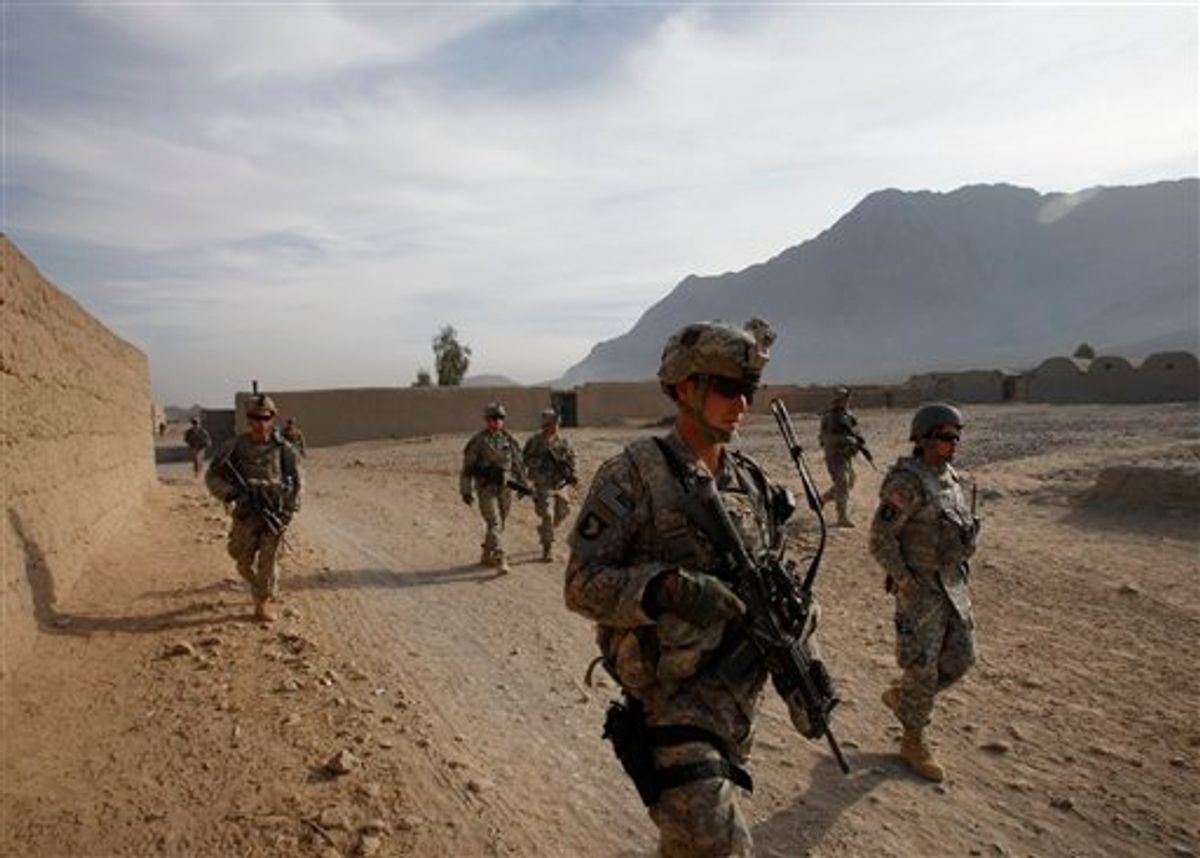 Second Lt. Jonathan Rezendes of Mass., foreground, and other U.S. soldiers from First Battalion, 502nd Infantry Regiment, 101st Airborne Division patrol in West Now Ruzi village, in Panjwai district, Afghanistan, Sunday, Nov. 21, 2010.(AP Photo/Alexander Zemlianichenko) (AP)