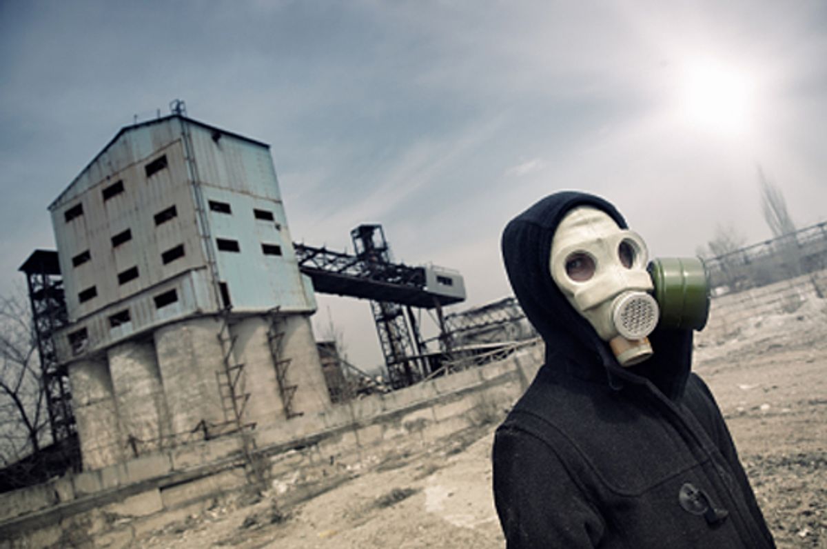 Human in gas mask outdoors and industrial factory on a background (Arman Zhenikeyev)