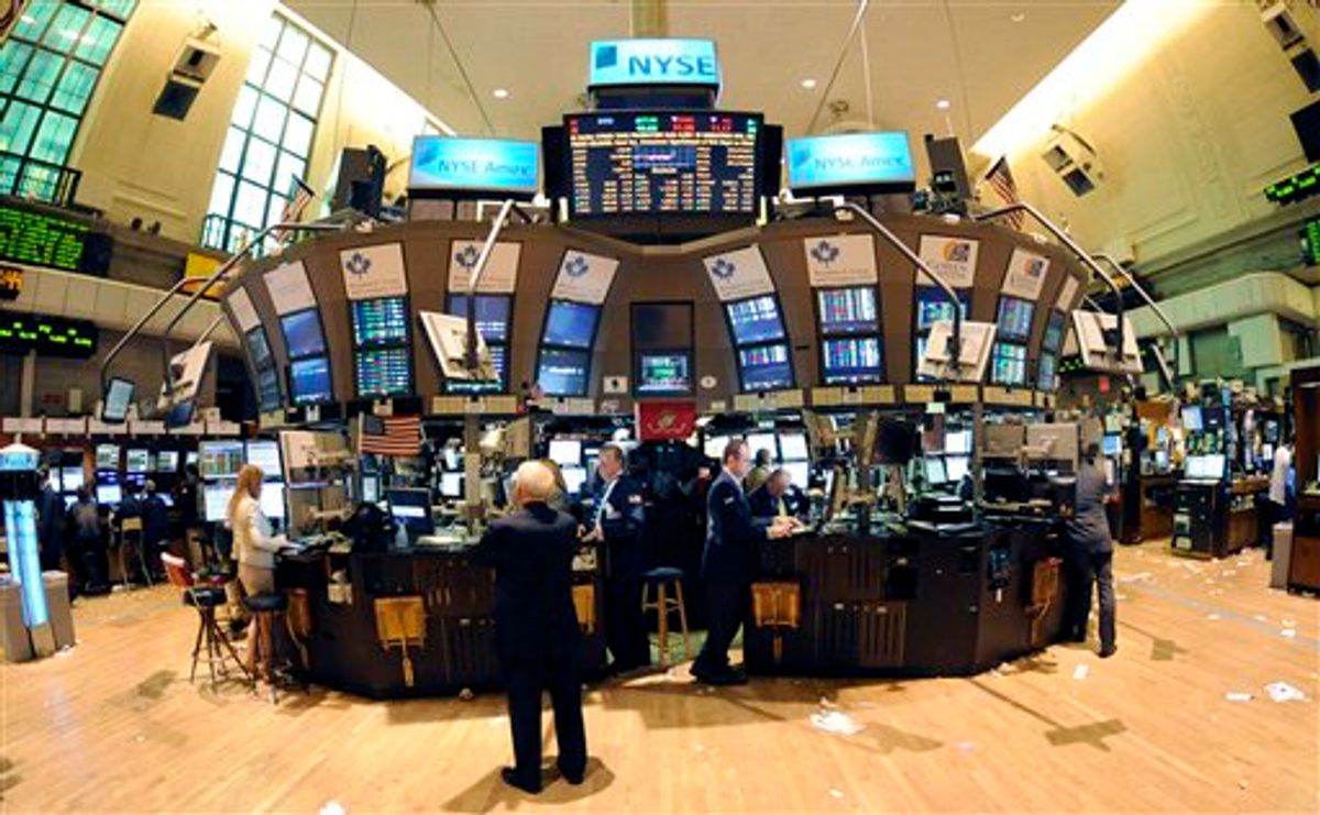 In this photo taken Sept. 21, 2010, trading continues on the floor of the New York Stock Exchange in New York. Stock futures edged lower Wednesday, Sept. 22, as traders turned to buying Treasury's and gold after the Federal Reserve failed to take any immediate steps to help the economy.(AP Photo/Henny Ray Abrams) (AP)