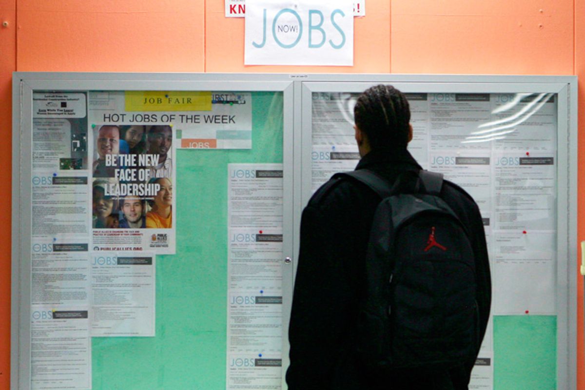 A man looks over employment opportunities at a jobs center in San Francisco.  