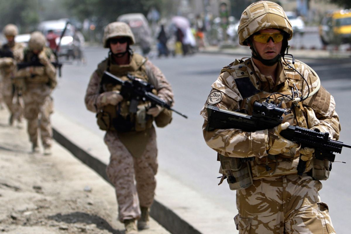 British soldiers patrol on a street in Kabul in July