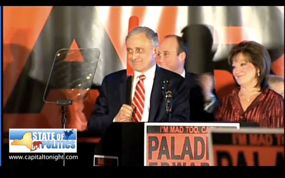 Carl Paladino holding a baseball bat during his concession speech Tuesday night.