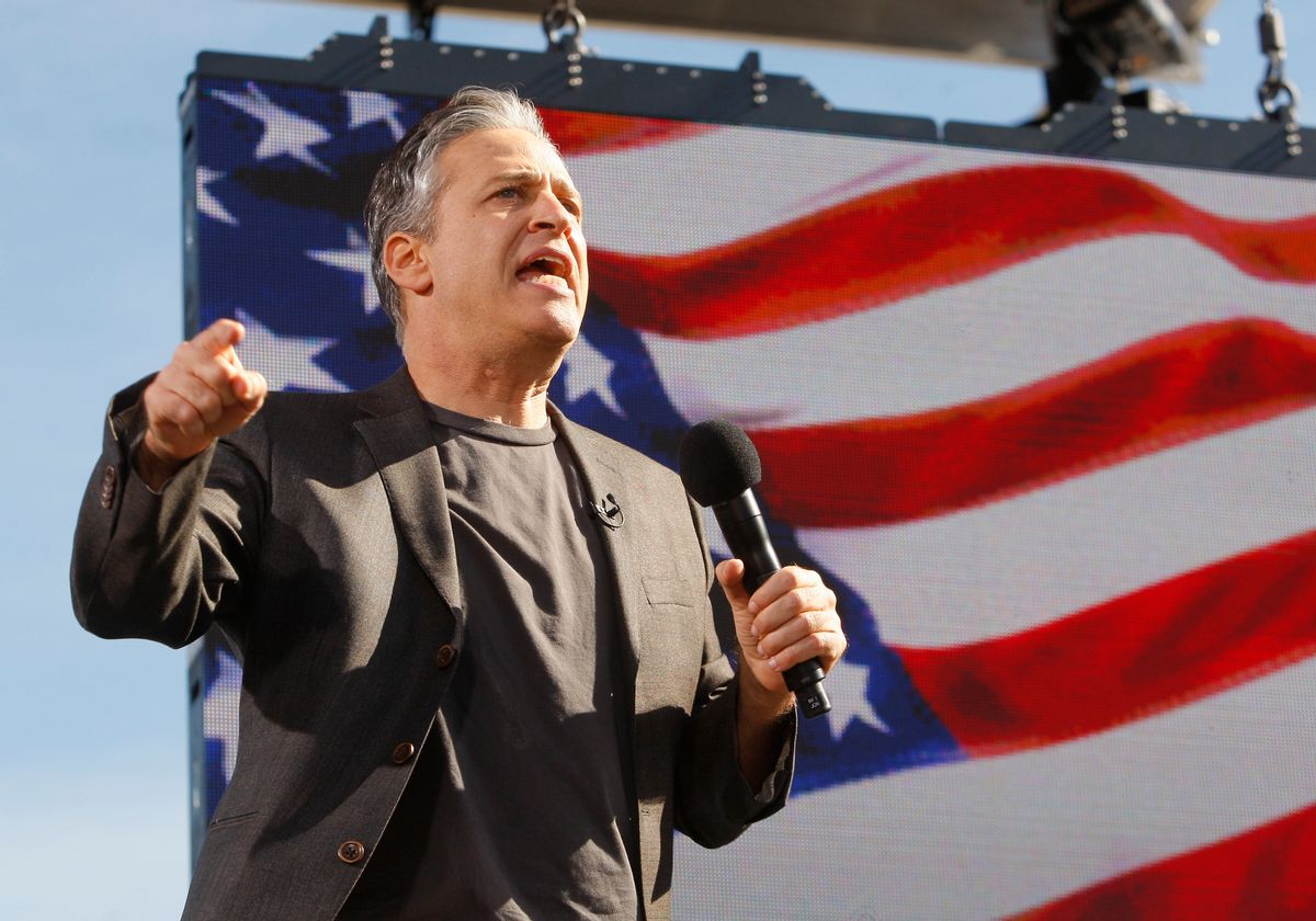 Comedian Jon Stewart addresses the crowd during the "Rally to Restore Sanity and/or Fear" in Washington, October 30, 2010. The rally is a counterpoint to recent partisan political rallies on both ends of the U.S. political spectrum  held in anticipation of the November 2nd Congressional midterm elections.   REUTERS/Jim Bourg  (UNITED STATES - Tags: POLITICS ENTERTAINMENT) (Reuters)