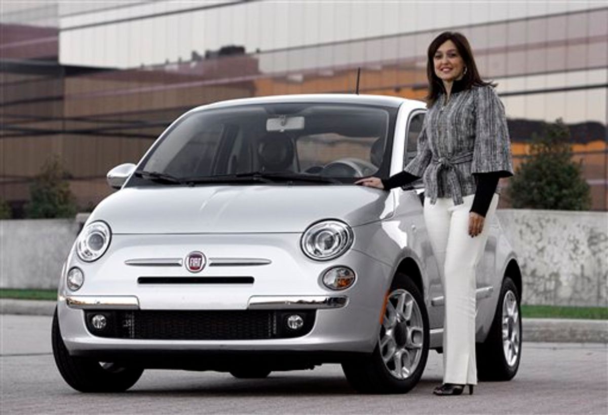 In this Nov. 10, 2010 photo, Laura J. Soave, head of the Fiat Brand for North America, stands next to a 2011 Fiat 500 in Auburn Hills, Mich.  (AP Photo/Paul Sancya) (AP)