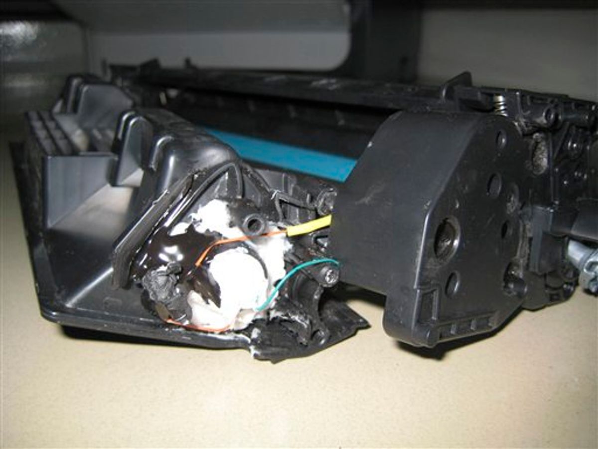 This undated photo released by the Dubai Police via the state Emirates News Agency (WAM) on Saturday, Oct. 30, 2010, claims to show parts of a computer printer with explosives loaded into its toner cartridge found in a package onboard a cargo plane coming from Yemen, in Dubai, United Arab Emirates. Dubai police say the bomb, discovered in the ink cartridge of a computer printer in a shipment of air cargo from Yemen bound for the United States, contained the powerful explosive PETN and bore the hallmarks of al-Qaida. (AP Photo/Dubai Police via Emirates News Agency) EDITORIAL USE ONLY, NO SALES (AP)
