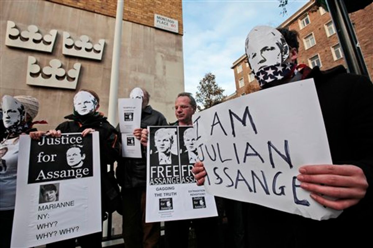 Supporters of WikiLeaks founder Julian Assange, some wearing masks depicting him and holding placards participate at a demonstration outside the Swedish Embassy In central London, Monday, Dec. 13, 2010. Assange remains in a U.K. jail ahead of a Dec. 14 hearing where he plans to fight Sweden's request to extradite him to face sex crimes allegations there. Marianne Ny, named on poster, is the Swedish Director of Public Prosecution.  (AP Photo/Lefteris Pitarakis)  (AP)