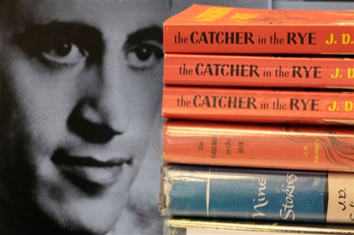 FILE - This Thursday, Jan. 28, 2010 picture shows copies of J.D. Salinger's classic novel "The Catcher in the Rye" as well as his volume of short stories called "Nine Stories" at the Orange Public Library in Orange Village, Ohio. Salinger, the legendary author, youth hero and fugitive from fame whose "The Catcher in the Rye" shocked and inspired a world he increasingly shunned, died Wednesday at the age of  91. At left is a 1951 photo of the author. (AP Photo/Amy Sancetta, File)       (AP)