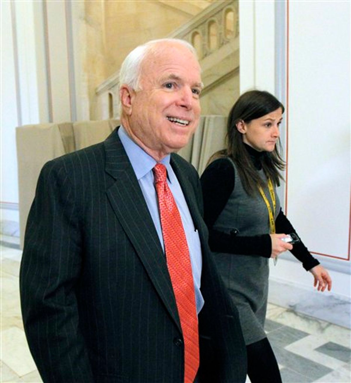Sen. John McCain, R-Ariz., the ranking  member of the Senate Armed Services Committee, walks on Capitol Hill in Washington Tuesday, Nov. 30, 2010, as committee staff members are receiving a briefing on the Armed Services Don't Ask Don't Tell survey. (AP Photo/Alex Brandon) (AP)