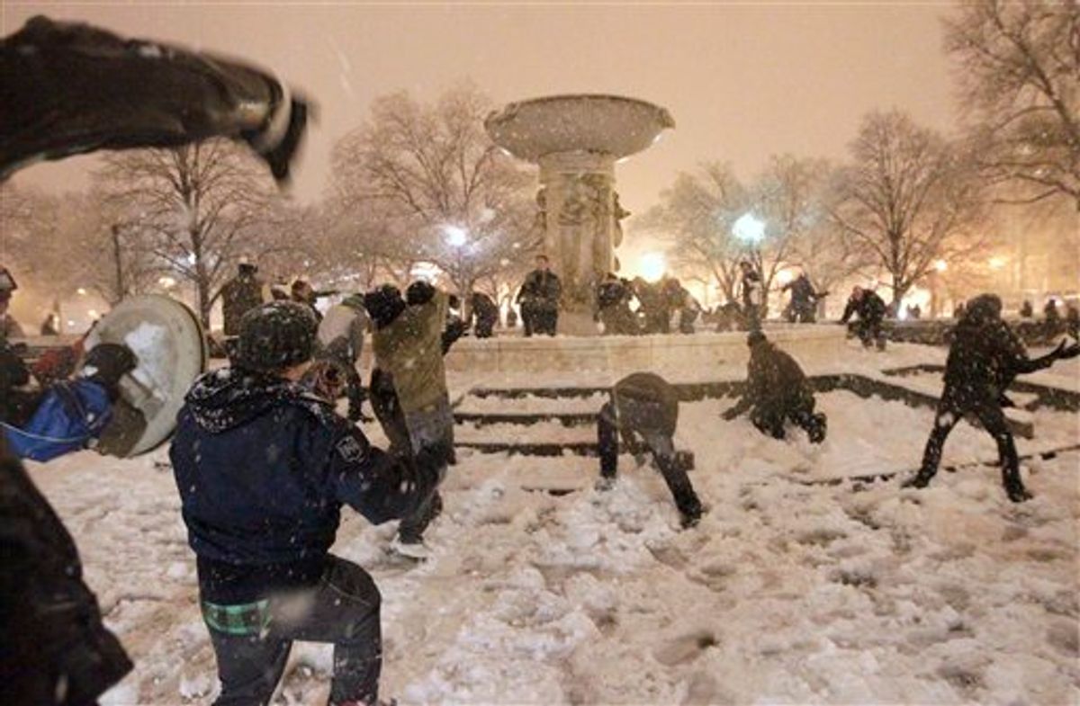 A snowball fight breaks out at Dupont Circle in Washington in the still-falling snow, Wednesday, Jan. 26, 2011. (AP Photo/Pablo Monsivais)  (AP)