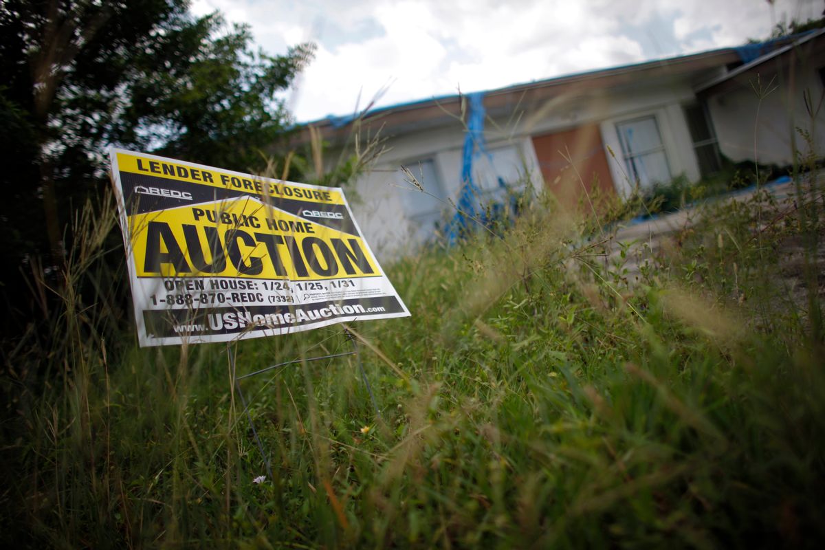 An auction sign for a property is seen at the front garden of a foreclosed house in Miami Gardens, Florida in this September 15, 2009 file photo. There are more than 6,600 home foreclosure filings per day, according to the Center for Responsible Lending, a nonpartisan watchdog group based in Durham, North Carolina. With nearly two million already this year, the flood of foreclosures shows no sign of abating any time soon. To match feature USA-HOUSING/FORECLOSURES   REUTERS/Carlos Barria/Files (UNITED STATES POLITICS BUSINESS)   (Reuters)