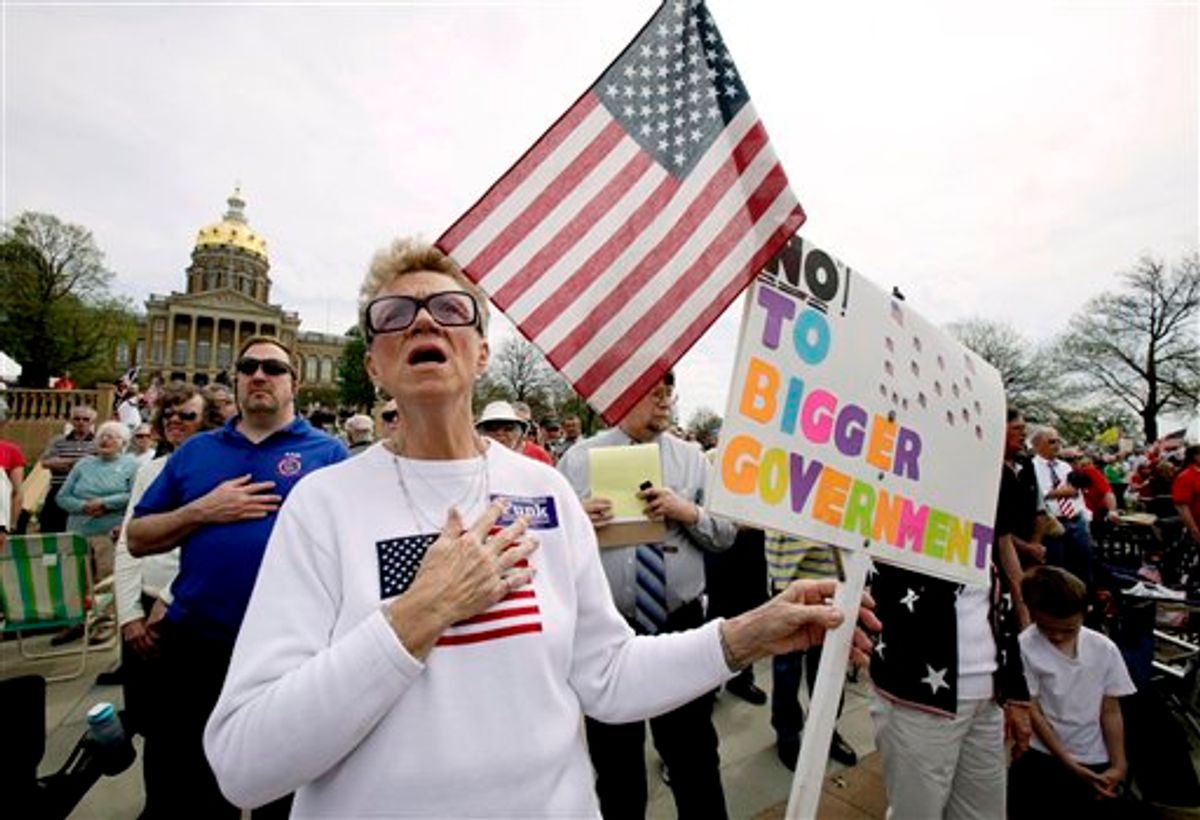 FILE - In this Thursday, April 15, 2010 file picture, Kay Hohler, of West Des Moines, Iowa, sings the national anthem before the start of a tea party rally on the steps of the Iowa Statehouse in Des Moines, Iowa. (AP Photo/Charlie Neibergall, File) (AP)