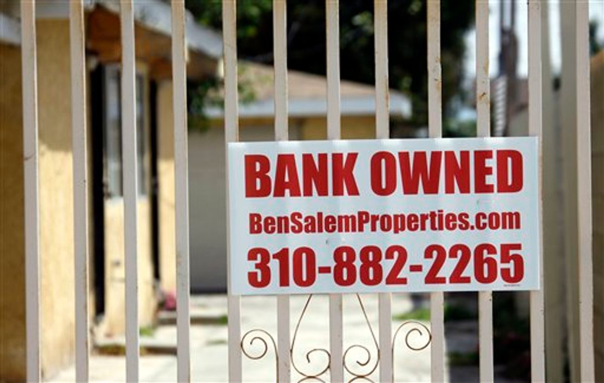 FILE - In this file photo taken July 21, 2010, a "bank owned" sign is seen on a home that is listed as a foreclosure on a HUD website, in Hawthorne, Calif. Complaints against banks are soaring, suggesting that new laws and regulations put in place since the financial crisis two years ago aren't dampening Americans' anger over overdraft fees and foreclosure practices they view as unfair.(AP Photo/Reed Saxon, file) (AP)