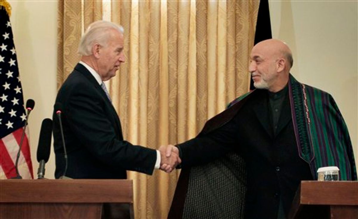 Afghan President Hamid Karzai, right, shakes hand with U.S. Vice President Joe Biden during a press conference in Kabul, Afghanistan, on Tuesday, Jan. 11, 2011. (AP Photo/Musadeq Sadeq)    (AP)