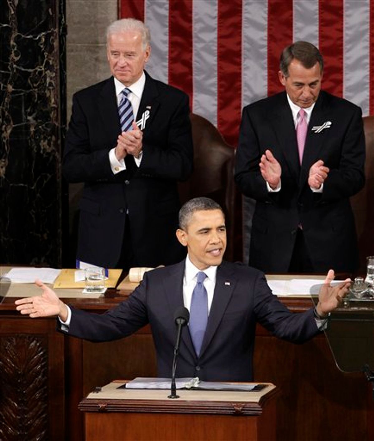President Barack Obama gestures on Capitol Hill in Washington, Tuesday, Jan. 25, 2011, prior to delivering his State of the Union address in Washington, Tuesday, Jan. 25, 2011. Vice President Joe Biden and House Speaker John Boehner of Ohio applaud at rear. (AP Photo/Charles Dharapak) (AP)