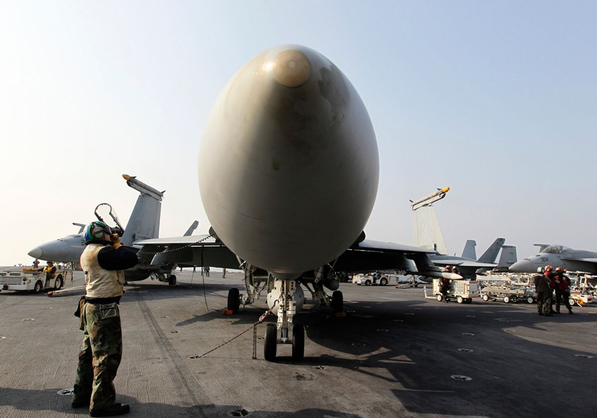 An F/A-18 Hornet fighter jet sits onboard the U.S. Navy's USS George Washington aircraft carrier.   (Reuters)