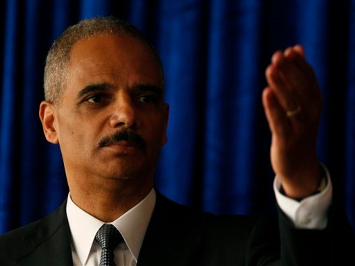 U.S. Attorney General Eric Holder gestures while speaking during a news conference in Hong Kong Tuesday, Oct. 19, 2010. The U.S. Attorney General on Tuesday urged Beijing to release Nobel Peace Prize winner Liu Xiaobo, a day before he was scheduled to meet with top law enforcement officials in mainland China. But Holder said he is unlikely to bring up Liu during his meetings in Beijing, which will focus on piracy and counterfeiting issues.  (AP Photo/Kin Cheung) (AP)