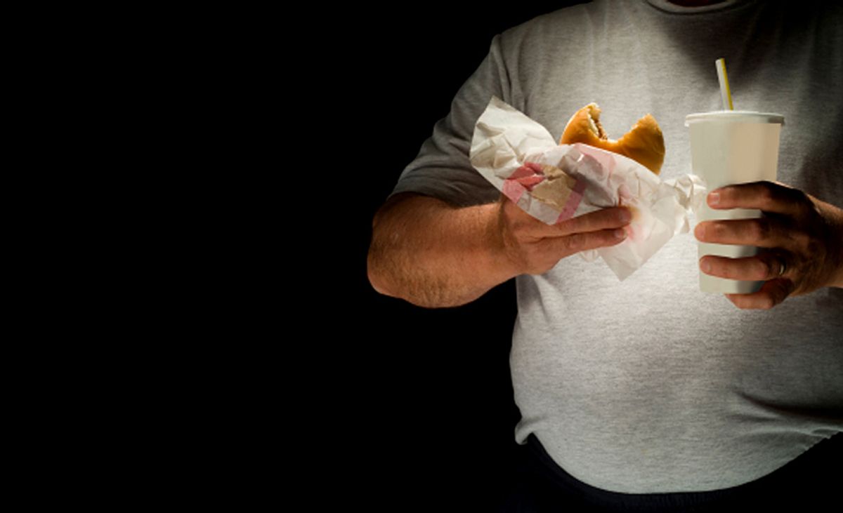 Digital Capture, man eating hamburger with soda.         (Brian Toro)