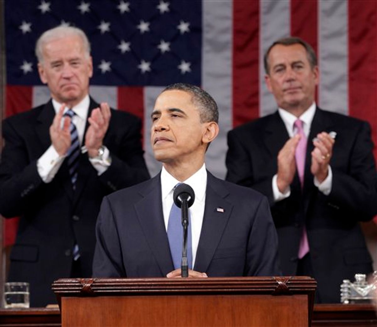 President Barack Obama is applauded by Vice President Joe Biden and House Speaker John Boehner on Capitol Hill in Washington, Tuesday, Jan. 25, 2011, while delivering his State of the Union address  (AP Photo/Pablo Martinez Monsivais, Pool) (AP)